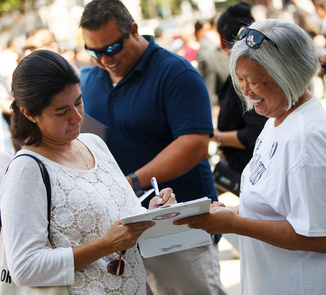 A LWV member registering a woman to vote