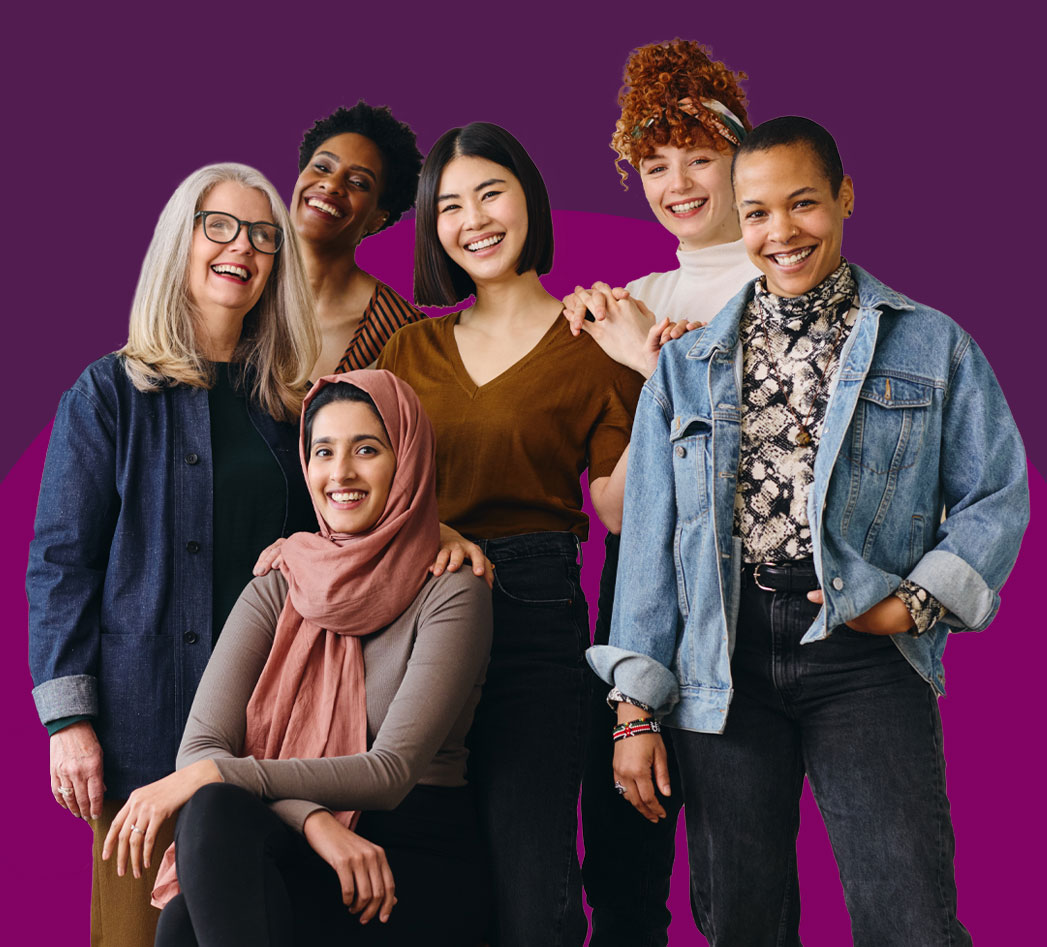 Six women smiling in front of a purple background