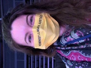 The author in a "feminist climate justice" mask"