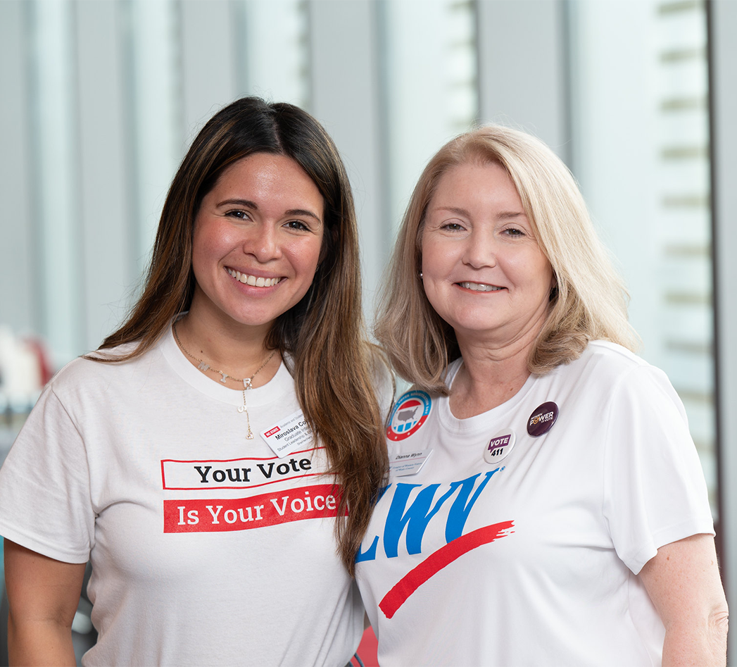 Dianna Wynn in an LWV shirt smiling with another woman