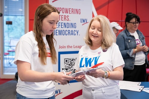 President Dianna Wynn registering someone to vote on NVRD