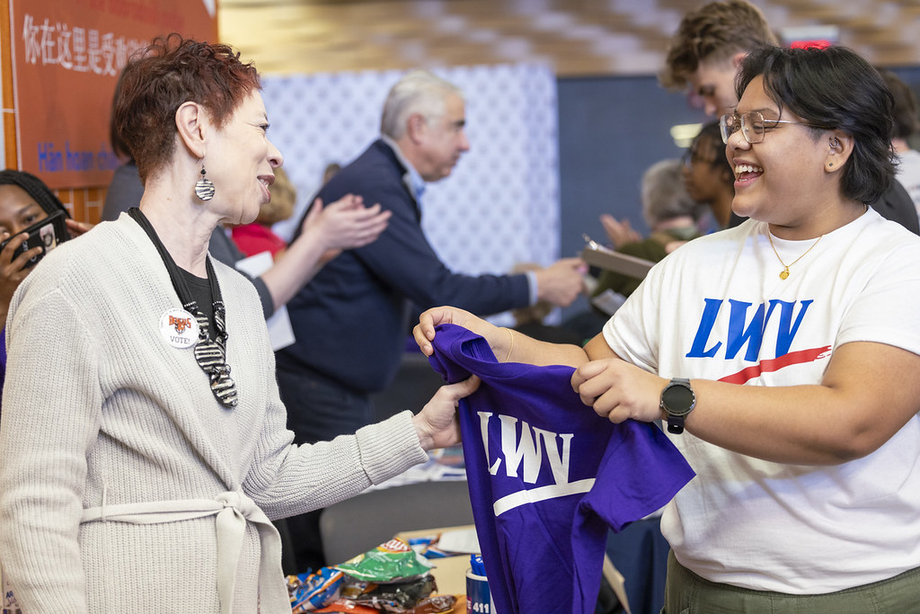 An LWV member handing out an 