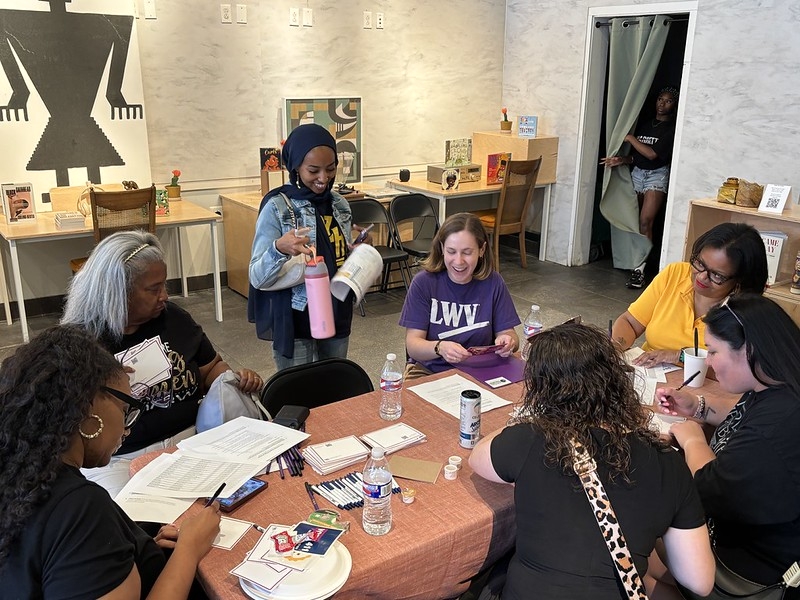 Volunteers write postcards