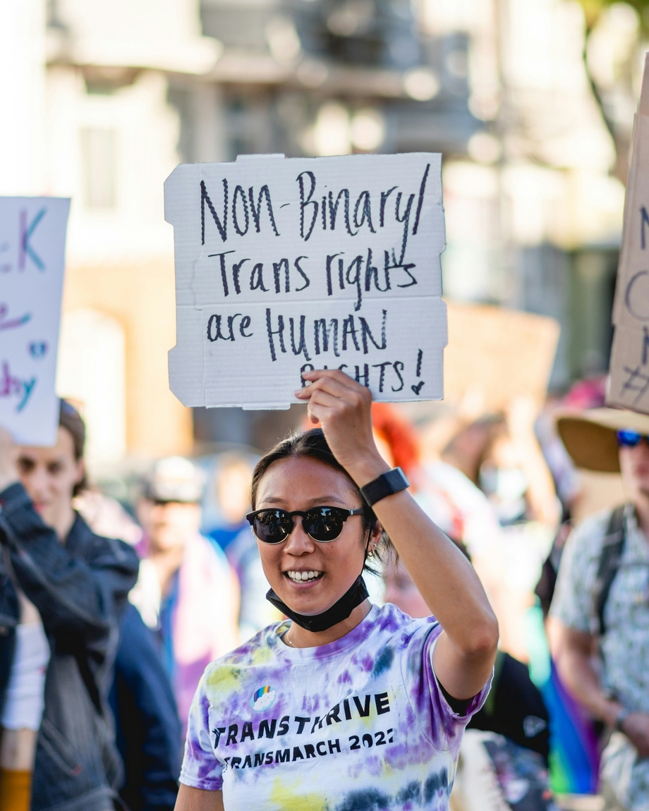 A person with a sign that says 